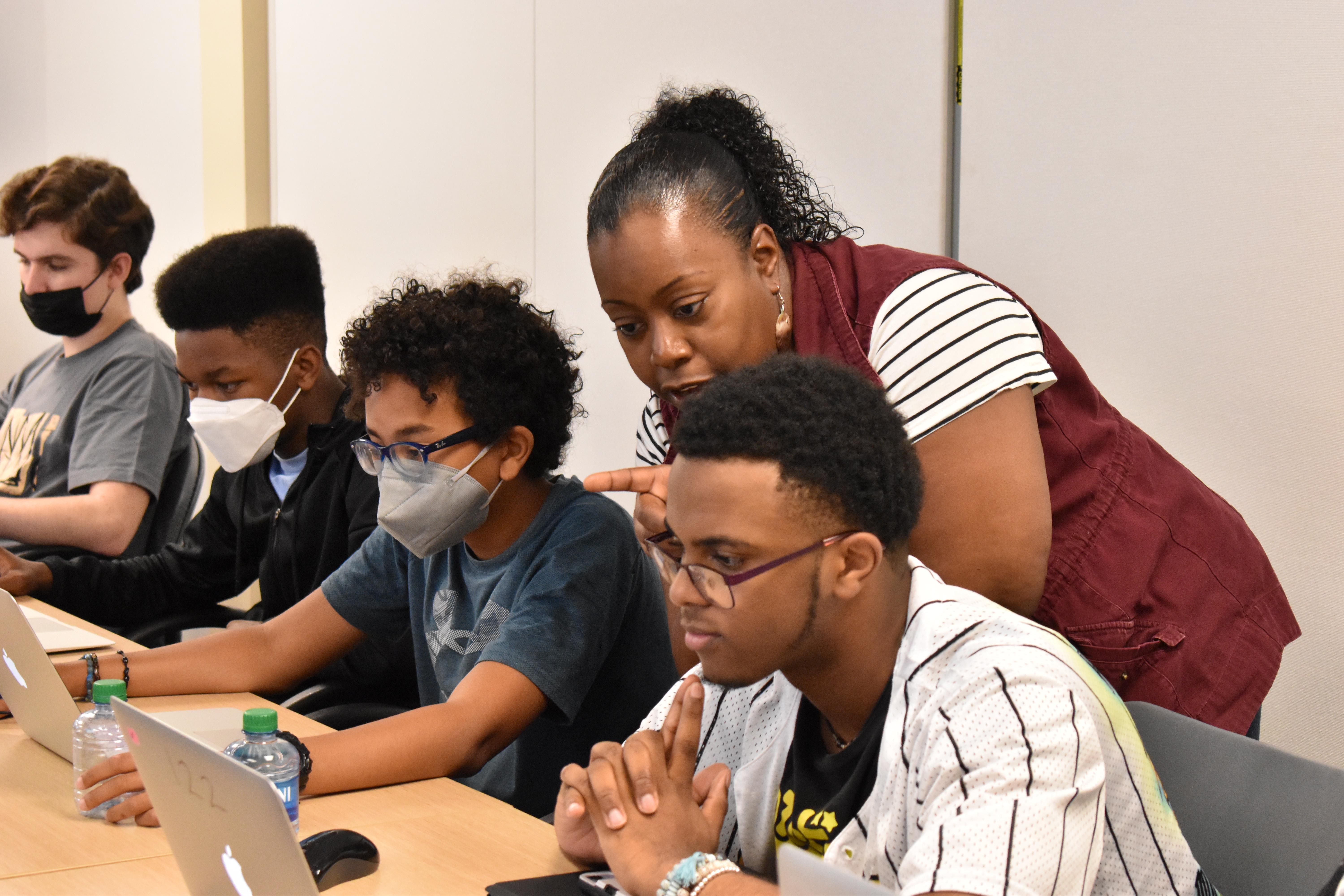 Computer Science Teacher helping students